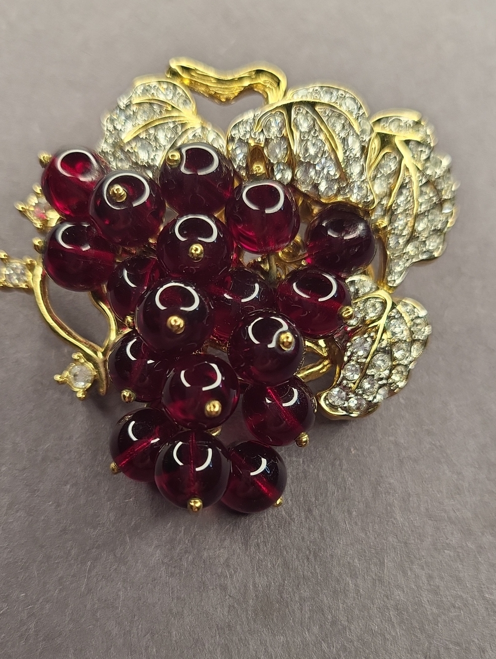 Nolan Miller Gold-Tone Red Cluster Grape Brooch with Crystal Leaves